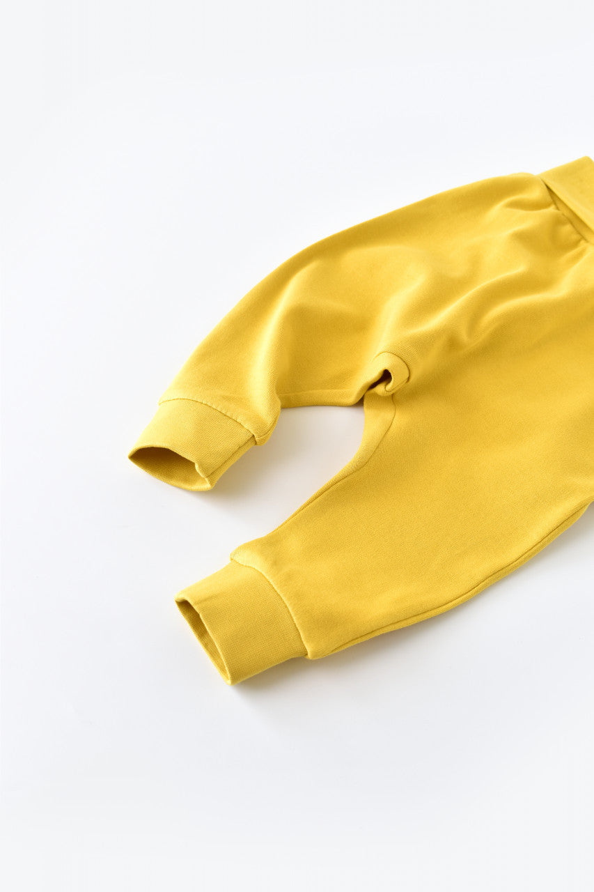 Pantaloni Bebe Unisex din bumbac organic Galben deschis BabyCosy
